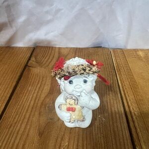 Charming White Figurine with Red and Brown Accents